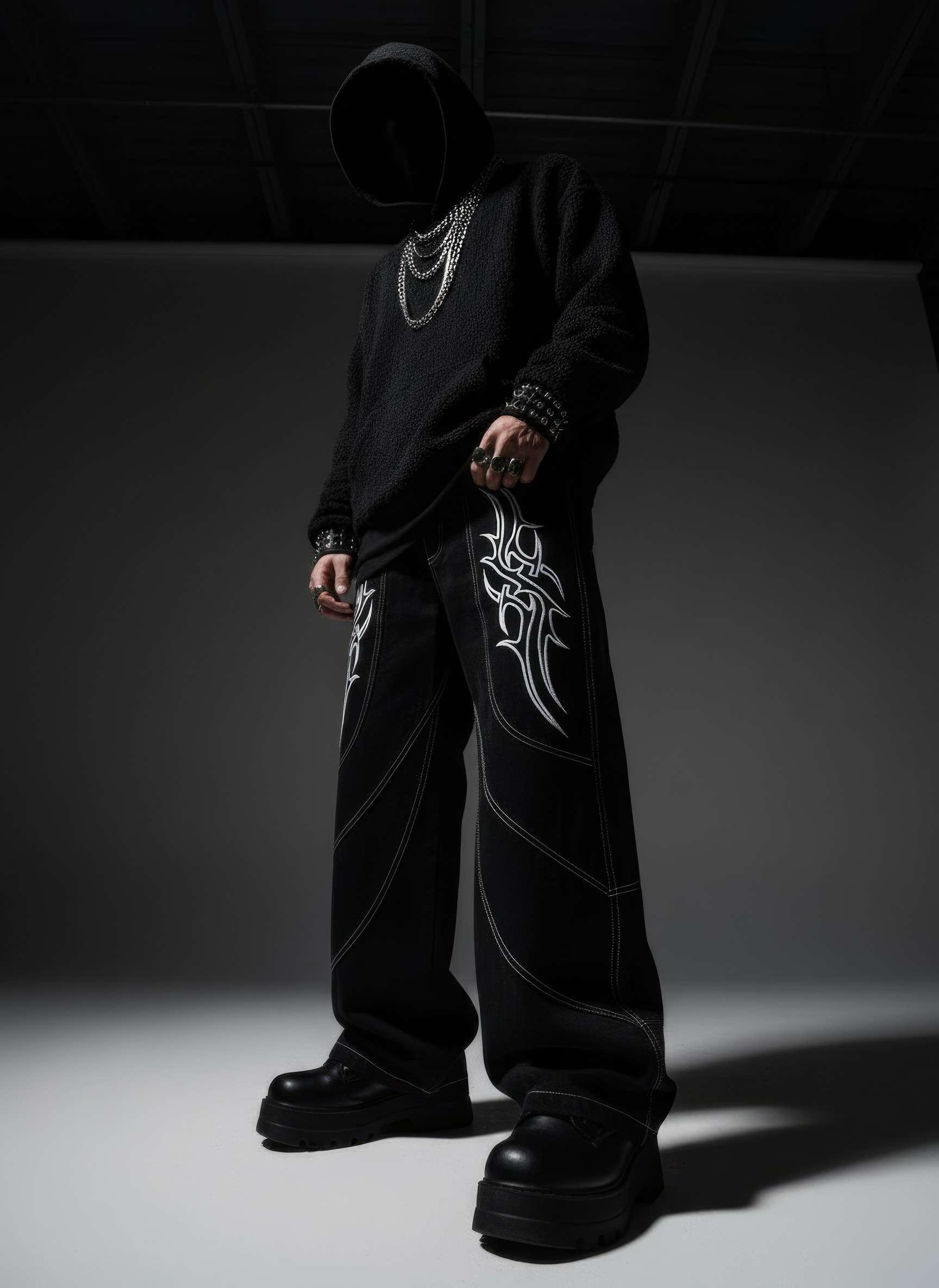 Person wearing black clothing with white patterns in a dark setting